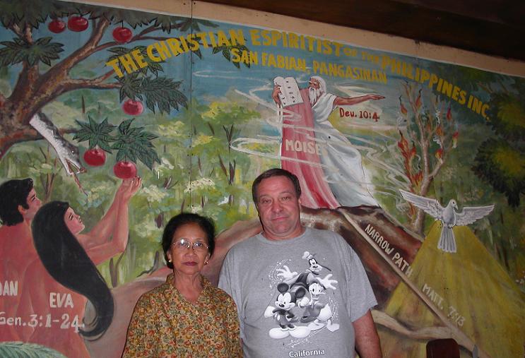A picture of a man and a woman with Christian art behind them
